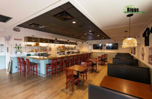 Jaco’s of Perdido Key Bar Keep area, Biggs Construction Company, Inc. Custom Wood Bar Counter Top and painted Bar Bead Board Bar front