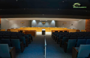 City of Pensacola Council Chambers. Biggs Construction Company, Inc. - Updated Cabinetry and added seamlessly add to existing City Council Chamber Dias, Podium, and Council Seating.