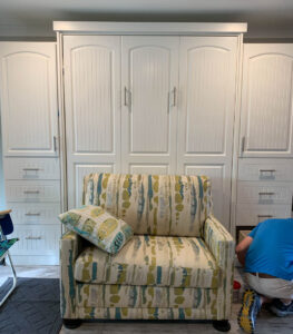 Sofa moves Murphy Bed w Side units Arched Bead board